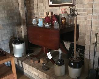Drop leaf table, crock jugs, collectibles