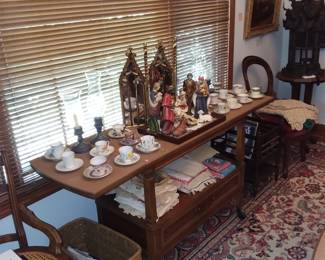 Sideboard server with Nativity and tea sets 