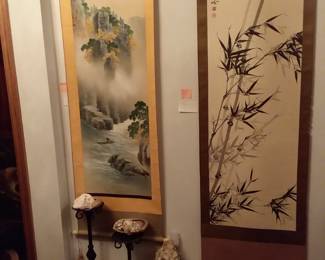 Master bedroom filled with Oriental wall hangings