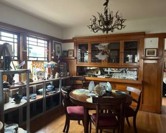 Many interesting objects....antique dining room table & chairs