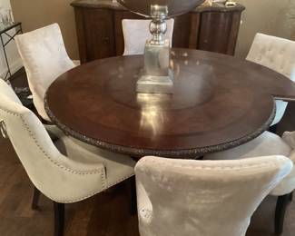 Beautiful dining room table with Leafs to expand for 10 or more people.. Leafs come off and the picture shows one leaf on and how beautiful the finished edge is without the Leafs and with the Leafs