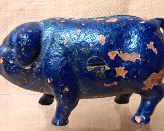CAST IRON PIGGY BANK W COINS INSIDE