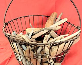EGG BASKET FULL OF DRIFT WOOD PIECES