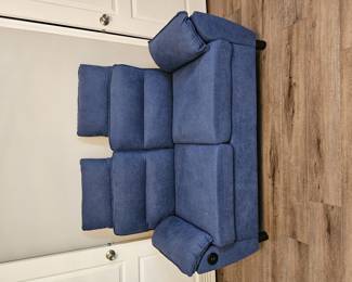Blue loveseat with charging ports