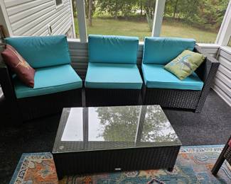 3 piece wicker couch and a wicker coffee table - sold separately.