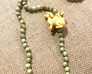 Jade beaded necklace with ceramic netsuke