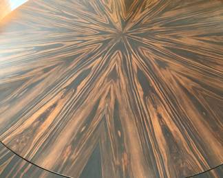 Detail of 1 of 2 circular wood tables woth center center leaf