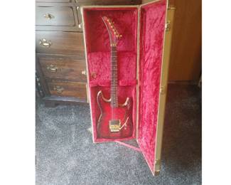 custom made gravity storm electric guitar, maple body, maple neck, floyd rose bridge comes with case asking $600