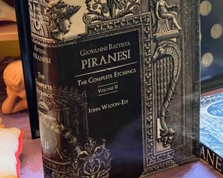 Piranesi...You'll find a series of prints going up the back stairs.