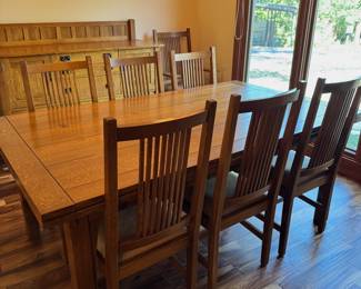 Stickley Dining table with 12 chairs, hidden leaves