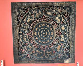 Wooden wall hanging of astrological symbols
