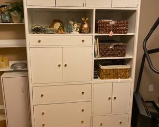 I’m really impressed with this solid wood cabinet That has been painted white and new brass knobs have been added. Cabinets , drawers , open space. This is a great little business center or craft cabinet.