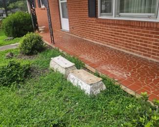 Concrete planters located front yard