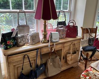 Pocketbooks , designer brands , most new with tags … Brighton , Vera Bradley , wallets , duffle bags , travel clothing bags, boutique purses , and more 