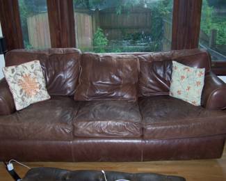 BROWN LEATHER THREE-CUSHION SOFA