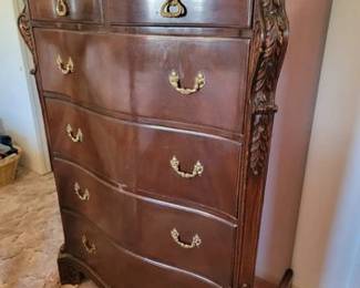 Chest of drawers with carved details and cedar lined bottom drawer