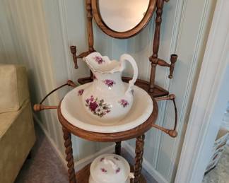 Vintage washstand with mirror includes pitcher, bowl, chamber pot