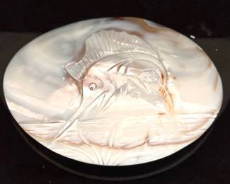 Mother of pearl belt buckle with a carved marlin