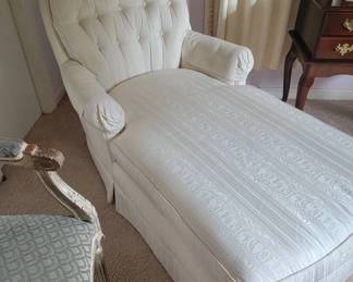 Upholstered chaise with tufted back and arms