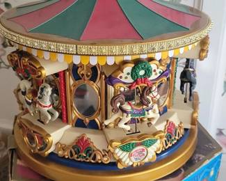 Holiday musical motion merry-go-round