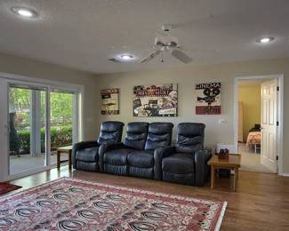 Theater, seating, reclining, chairs, rug, and wall art