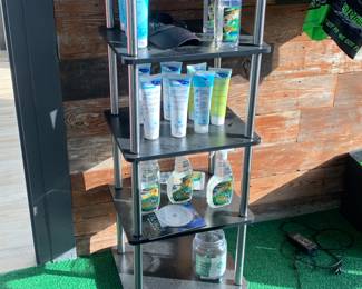 Miscellaneous swim shampoo, lotion and conditioner and small shelf display stand