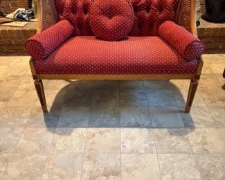 Caned upholstered loveseat French Empire