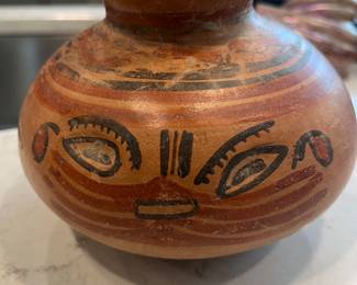 Terra cotta bowl with the face of a cat. Pre-Colombian