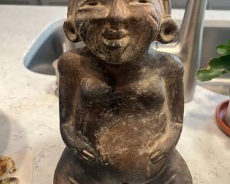 Seated figure of a woman/flute. Olmecoid, 300 BC. Perfect, uncleaned condition. Very rare. Found on Southern Pacific coast of Guatemala.