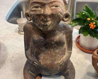 Seated figure of a woman/flute. Olmecoid, 300 BC. Perfect, uncleaned condition. Very rare. Found on Southern Pacific coast of Guatemala.