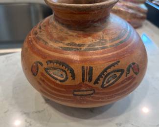 Terra cotta bowl with the face of a cat. Pre-Colombian