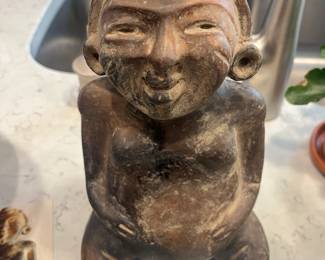 Seated figure of a woman/flute. Olmecoid, 300 BC. Perfect, uncleaned condition. Very rare. Found on Southern Pacific coast of Guatemala.