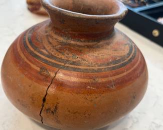 Terra cotta bowl with the face of a cat. Pre-Colombian