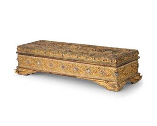 2298
A Thai jeweled giltwood Sutta box
20th century
The box with inset hardstones and carved foliate and figural motifs in relief, containing 28 painted suttas and several decorated wood panels
7" H x 28" W x 10" D
Estimate: $300 - $500