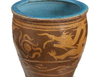 2185
A large Asian ceramic jardinière
19th century or later; China or Southeast Asia
The large ovoid jardinière depicting a dragon motif in ochre and brown glazes, with a blue glazed interior
19.5" H x 20.5" Dia.
Estimate: $400 - $600