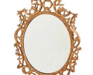 2250
A George III-style giltwood wall mirror
Late 19th/early 20th century
The oval mirror surrounded by a carved giltwood frame with acanthus, C-scrolls, and floral sprays, surmounted by a floral bough crest
52" H x 33" W x 6" D
Estimate: $500 - $700