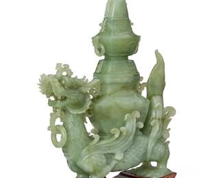 2182
A Chinese hardstone carving
20th century
The dragon-form body surmounted by a two-part pagoda, with ring accents throughout, set in a carved wood stand
Stone assembled: 14.625" H x 10.75" W x 3" D; Overall: 15.875" H x 10.875" W x 3.5" D
Estimate: $300 - $500