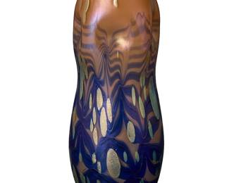 2091
A Johann Loetz Witwe glass 'Cytisus Neuroth' vase
Circa 1900
Unsigned
The waisted ovoid with dimpled shoulder, salmon-colored above blue pulled stripes and oil spotting
8.125" H x 3.25" Dia.
Estimate: $1,500 - $2,500