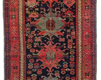 2450
A Caucasian geometric wide runner
Early 20th century
Wool on wool foundation
10' 10" x 4' 9" W
Estimate: $1,000 - $1,500