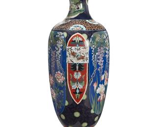 2067
A monumental Japanese cloisonné vase
20th century
The baluster-form enamel on copper vase decorated with alternating polychrome floral motifs and butterflies, with a swirled wave motif band to the shoulder and a green dragon encircling the neck
61" H x 20" Dia.
Estimate: $2,000 - $3,000