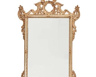 2273
A George II-style giltwood wall mirror
Late 19th/early 20th century
The beveled rectangular mirror surrounded by a carved giltwood frame with rocaille, acanthus, and inset mirror banding, surmounted by a floral urn crest
60" H x 36" W x 4.5" D
Estimate: $800 - $1,200