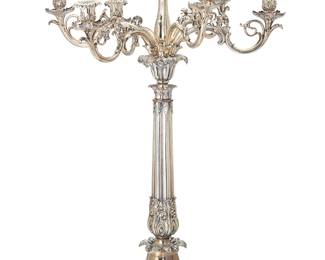 2002
An English silver-plated candelabrum
Early 20th century
With inscribed armorial: vigilate et orate; otherwise appears unmarked
Likely Sheffield, the seven-light candelabrum with foliate-cast nozzles and floriform bobèches, on a fluted columnar standard over a spreading base with scrolled foliate feet
32" H x 22.75" Dia.
Estimate: $700 - $900