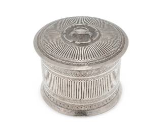 2288
A Burmese sterling silver betel nut box
20th century
Appears unmarked
The round vessel with chased and repoussé reeded pattern, the lid with a haute-relief crab motif within a C-scroll medallion
4.75" H x 6" Dia.
18.9 oz. troy approximately
Estimate: $300 - $500