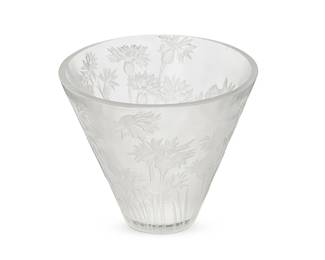 2104
A René Lalique glass 'Bleuets' vase
Early 20th century
Wheel-cut: R LALIQUE / FRANCE; further etched: No 909
The molded and frosted glass vase depicting stalks of cornflowers
6.25" H x 7.25" Dia.
Estimate: $300 - $500