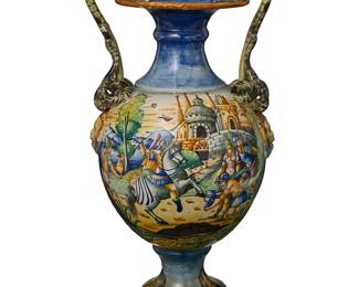 2233
An Italian maiolica snake-handled urn
19th/early 20th century
Appears unmarked
The baluster-form urn with opposed snake-form handles above lion's head masks in relief, the body painted with Neoclassical historical scenes above the foot depicting a village
24" H x 11" W x 10.5" D
Estimate: $400 - $600