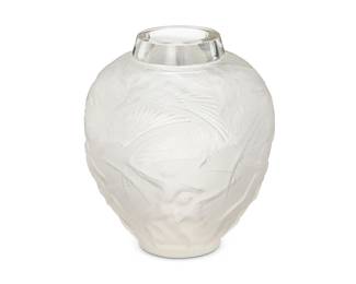 2108
A Rene Lalique glass 'Archers' vase
Marcilhac 893, pre-1945
Marked: R Lalique France / No 893 [in engraved script]
Designed 1921, the molded, polished, and frosted glass vase depicting birds in flight above archer figures
10.5" H x 9" Dia.
Estimate: $1,000 - $2,000