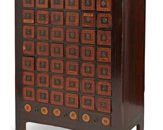 2326
A Chinese lacquered wood apothecary cabinet
Late 19th/20th century
The cabinet with metal ring pulls, featuring forty-two small drawers with two inner partitions above three longer lower drawers, each bearing Chinese characters
46.75" H x 34.25" W x 18.5" D
Estimate: $300 - $500