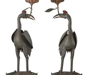 2310
A pair of Chinese pewter crane candlesticks
20th century
Each possibly depicting a Manchurian crane figure with a cloud form supported in its beak, set on a hexagonal stand with openwork gallery
2 pieces
Each: 23.5" H x 8" W x 7" D, approximately
Estimate: $150 - $250