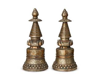 2125
A pair of Asian metal stupa
19th/20th century; Tibet or greater Vajrayana Diaspora
Undersides with a chased floral medallion
Each copper stupa, or, chortens, with partial zinc plating and chased designs
2 pieces
Each: 10.75" H x 4.5" Dia.
Estimate: $1,000 - $1,500