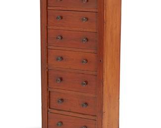 2385
A Victorian mahogany Wellington chest
19th century
The seven-drawer wood chest with turned wood knob pulls and locking vertical side panel
51.5" H x 22.25" W x 15.5" D
Estimate: $400 - $600